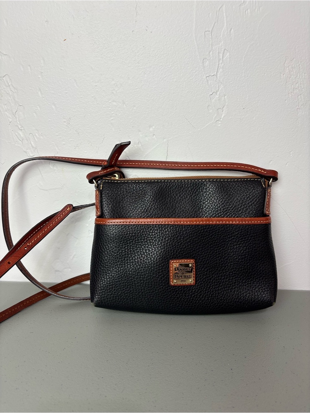 Dooney & Bourke Black Pebble Leather Crossbody with Brown Trim Zip Closure
